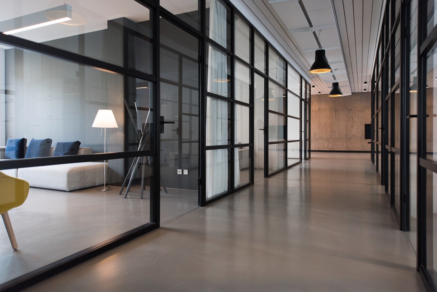 Commercial building corridor with modern overhead lighting