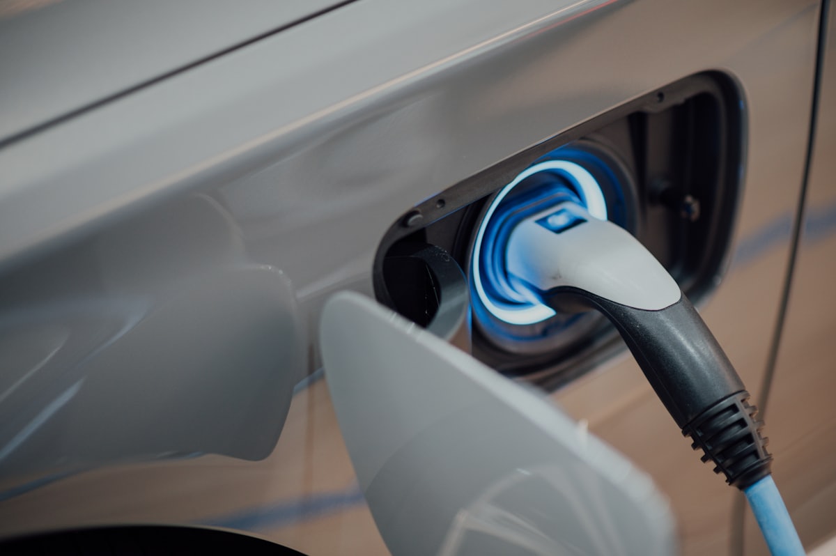 Electric vehicle plugged into a home charging connector