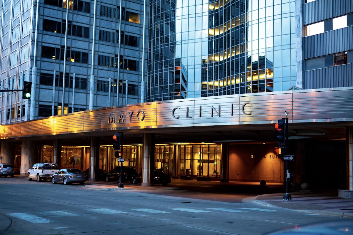 Healthcare facility exterior illuminated at dusk